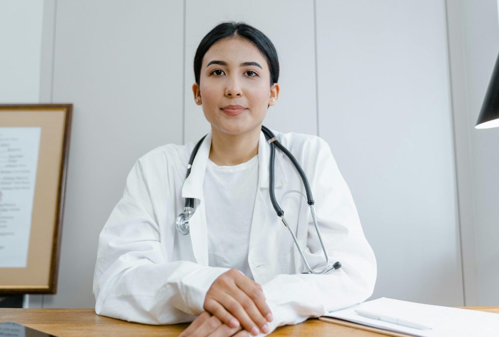 A healthcare provider discussing hormone testing and estrogen dominance with a woman in her 40s.