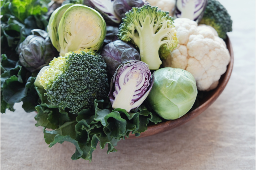 Bowl filled with cruciferous vegetables including broccoli, cauliflower, cabbage, kale, and Brussels sprouts, illustrating foods that support liver detox and help balance hormones naturally.
