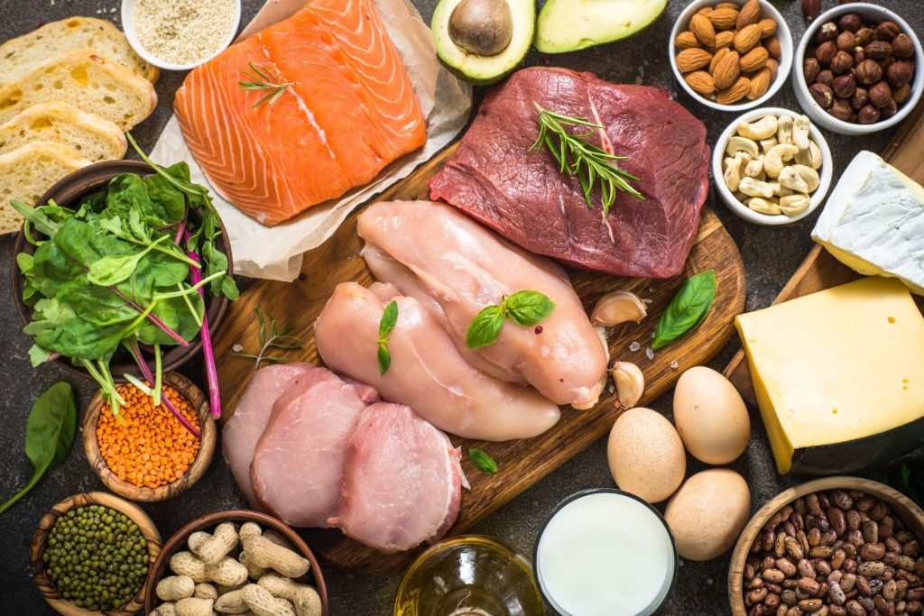Whole foods rich in protein, healthy fats, and fiber that help balance hormones naturally, including fish, eggs, nuts, beans, and leafy greens.