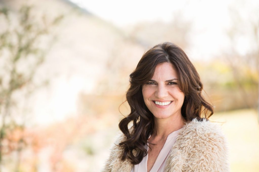 Healthy woman over 40 with thick hair representing hormone balance and hair health